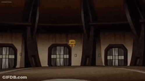 A Yellow Ball With A Face On It Is Spinning In A Cartoon . GIF
