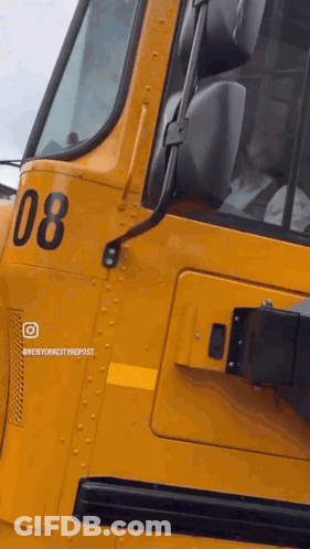 A Yellow Bus With The Number 08 On The Side GIF