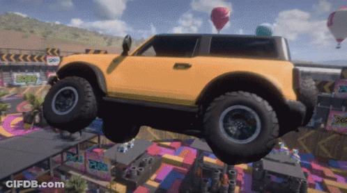 A Yellow Car Is Flying Through The Air With A Sign That Says Xtreme GIF