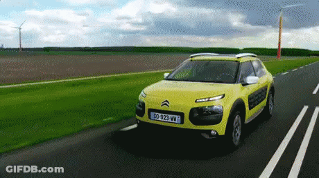 A Yellow Car With A License Plate That Says Dd-929-Vw GIF