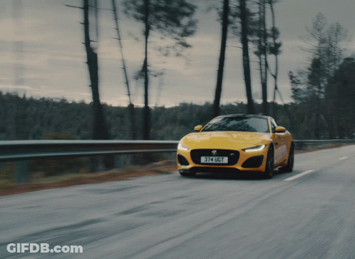 A Yellow Car With The License Plate 374 Ugt GIF