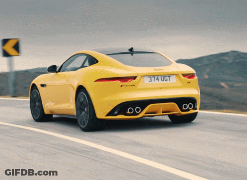 A Yellow Car With The License Plate 374 Ugt GIF