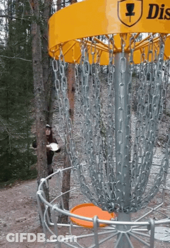 A Yellow Disc Golf Basket With A Man Holding A Frisbee GIF
