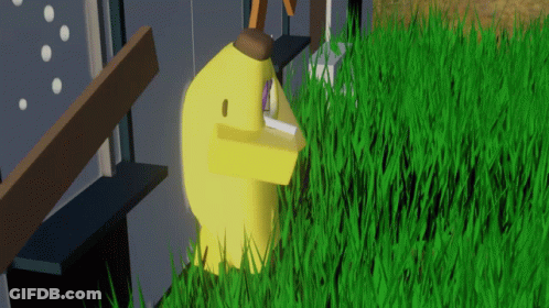A Yellow Duck Is Standing In A Field Of Tall Grass GIF