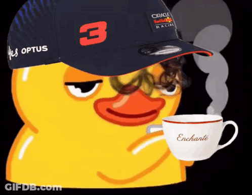 A Yellow Duck Wearing A Red Bull Hat Is Drinking From A Cup GIF