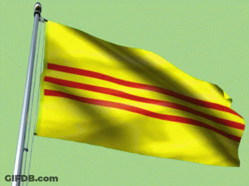 A Yellow Flag With Red Stripes On It Is Flying In The Wind GIF