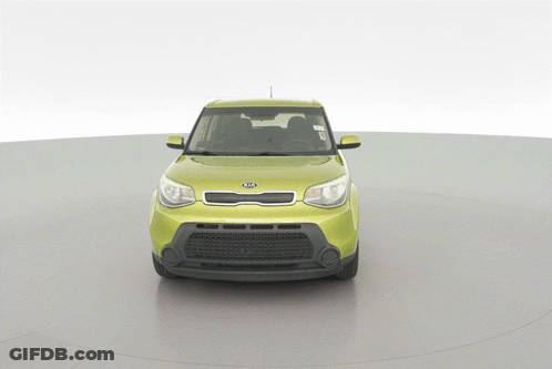 A Yellow Kia Car Is On Display On A White Background GIF