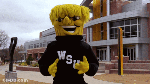A Yellow Mascot Wearing A Black Sweater That Says Ws GIF