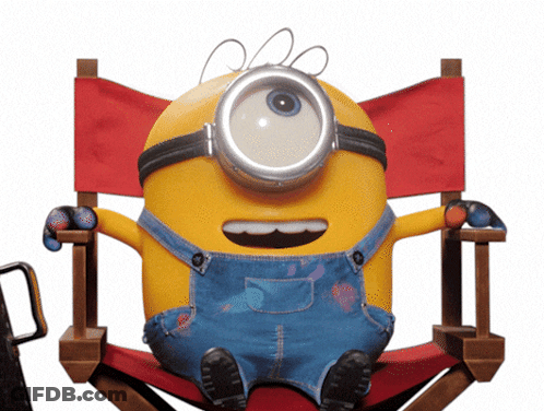 A Yellow Minion Is Sitting In A Red Directors Chair GIF