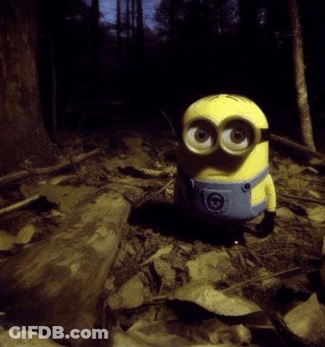 Yellow Minion Sitting In Woods GIF