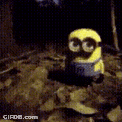 A Yellow Minion With Glasses And The Number 3 On His Face GIF