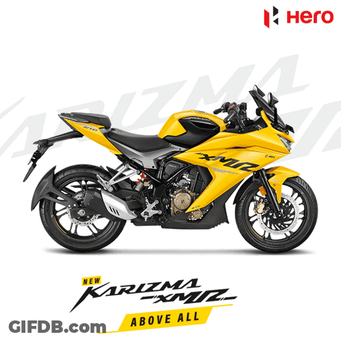 A Yellow Motorcycle With The Words Karizma Above All On It GIF
