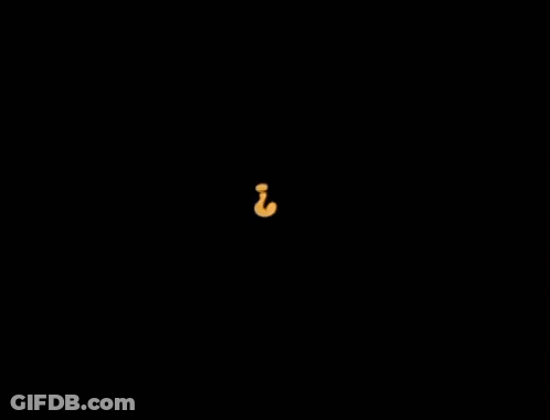 A Yellow Question Mark With A Circle Around It On A Black Background GIF