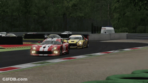 A Yellow Race Car With Sks Ag On The Side GIF