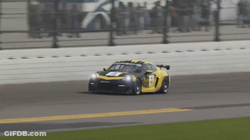 A Yellow Race Car With The Number 17 On The Front GIF