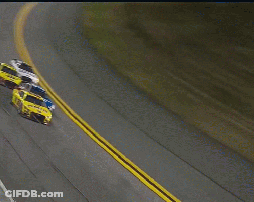 A Yellow Race Car With The Number 22 On The Side GIF