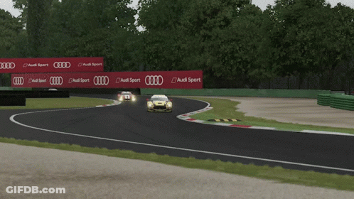 A Yellow Race Car With The Number 35 On The Side Of It GIF