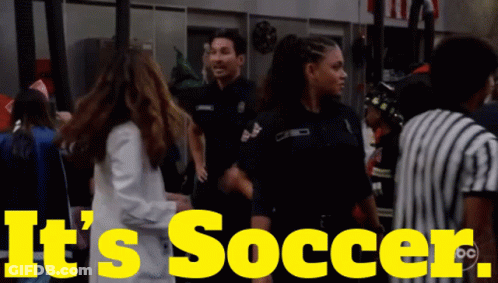 A Yellow Sign That Says It 'S Soccer With A Group Of People GIF