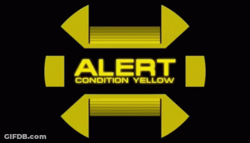 A Yellow Sign With The Words Alert Condition Yellow On It GIF