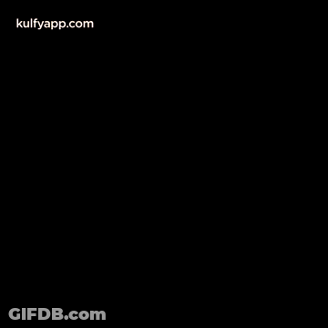 A Yellow Sign With The Words `` Happy New Year '' Surrounded By Fireworks On A Black Background . GIF