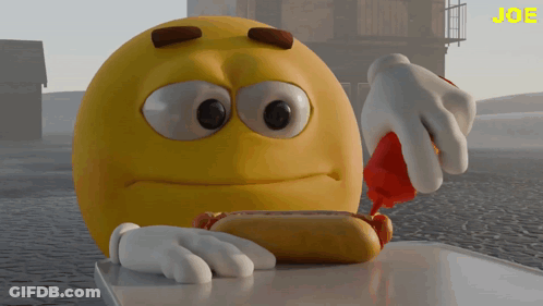 A Yellow Smiley Face Is Eating A Hot Dog With Ketchup On It GIF