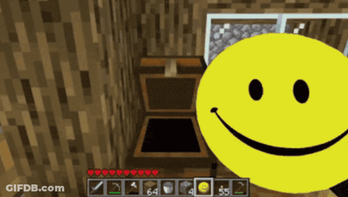 A Yellow Smiley Face Is In Front Of A Wooden Chest In A Video Game GIF