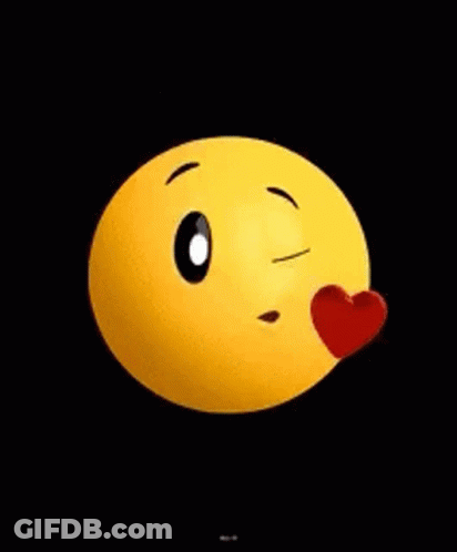 A Yellow Smiley Face With A Red Heart Coming Out Of It 'S Mouth On A Black Background . GIF