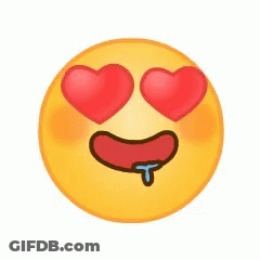 A Yellow Smiley Face With Two Red Hearts In Its Eyes And A Tongue Sticking Out . GIF