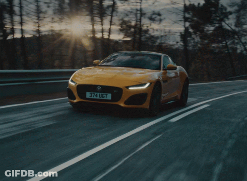 A Yellow Sports Car With The License Plate 374 Ugt GIF