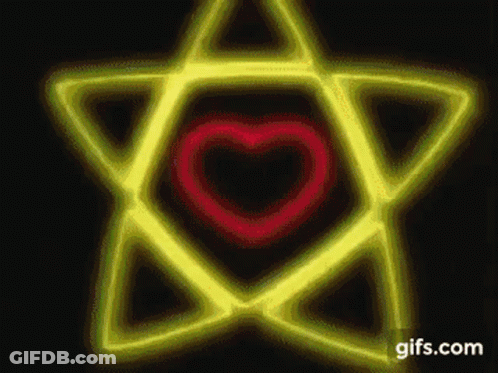 A Yellow Star With A Red Heart In The Middle . GIF