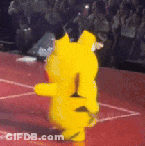 A Yellow Teddy Bear Is Dancing On A Red Floor GIF