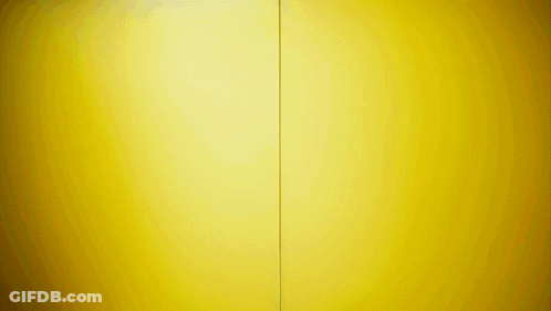 A Yellow Wall With A Red Stripe On The Bottom GIF