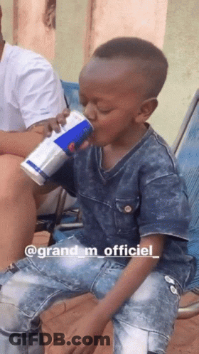 A Young Boy Drinking A Pepsi Can From A Blue Can GIF