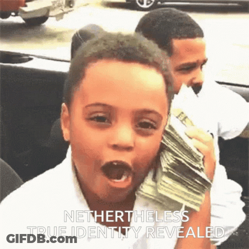 A Young Boy Holding A Stack Of Money With The Words Nethertheless True Identity Revealed Above Him GIF