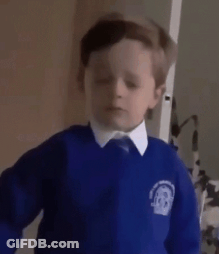 A Young Boy In A Blue School Uniform Is Asking The Question Yes . GIF