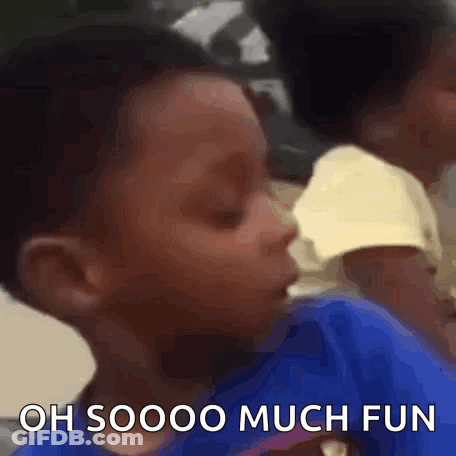 A Young Boy In A Blue Shirt Is Making A Funny Face And Saying `` Oh Soooo Much Fun '' . GIF