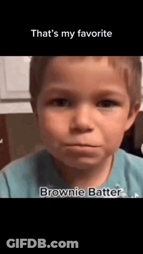 A Young Boy In A Blue Shirt Is Making A Funny Face And Saying `` That 'S My Favorite Brownie Batter '' . GIF