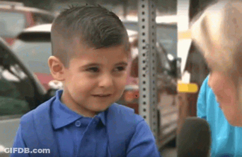 A Young Boy In A Blue Shirt Is Talking To A Woman In A Blue Shirt GIF