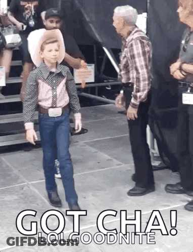 A Young Boy In A Cowboy Outfit Is Standing Next To A Man In A Plaid Shirt With The Words Got Cha Lolgoodnite Below Him GIF