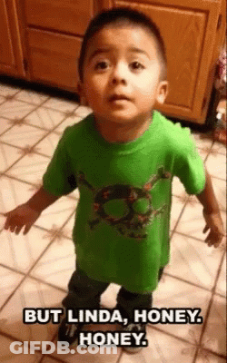 A Young Boy In A Green Shirt With A Skull On It GIF