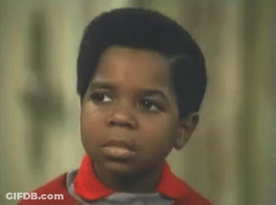 Boy In Red Shirt Making Funny Face Asking What You Talkin Bout GIF