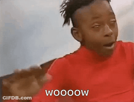 A Young Boy In A Red Shirt Is Making A Funny Face And Says Wooow . GIF