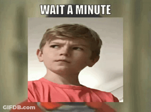 A Young Boy In A Red Shirt With The Words Wait A Minute Above Him GIF