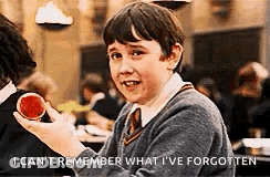 A Young Boy In A School Uniform Is Holding A Red Apple And Smiling . GIF