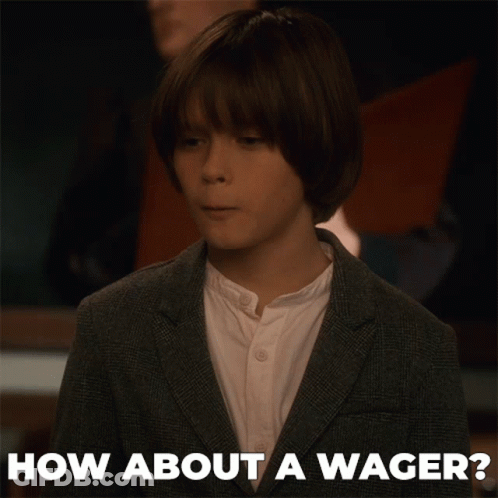 A Young Boy In A Suit And White Shirt Is Asking How About A Wager GIF