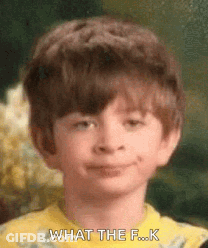 A Young Boy In A Yellow Shirt Is Making A Funny Face And Says `` What The F ... K '' . GIF