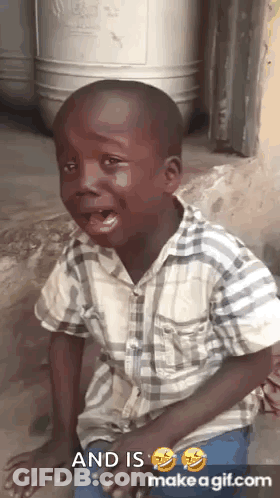 A Young Boy Is Crying While Sitting On The Ground . GIF