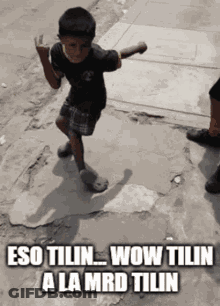 A Young Boy Is Dancing On The Sidewalk With The Words Wow Tilin A La Mrd Tilin GIF