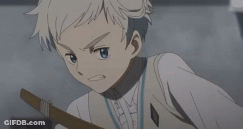 A Young Boy Is Holding A Bow And Arrow GIF