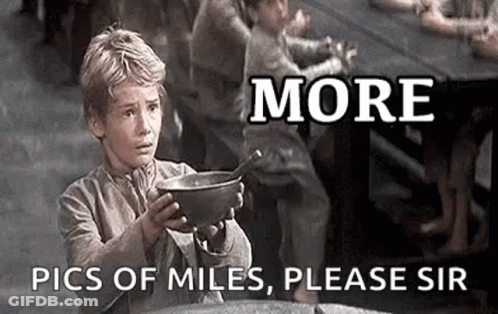 A Young Boy Is Holding A Bowl Of Food And Asking For More Pics Of Miles . GIF